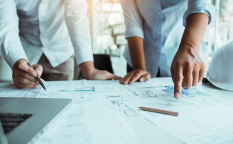 Two architect working at construction site