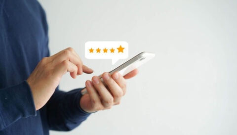 phone with 5 star review icon