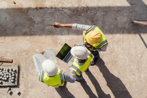 general contracting services in naples florida with three guys observing construction site